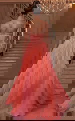 Back view of strapless tulle gown with structured corset and flowing train