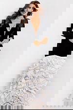 Elegant evening dress with long sleeves and layered skirt