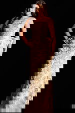 strapless gold evening gown, featuring intricate floral embroidery.