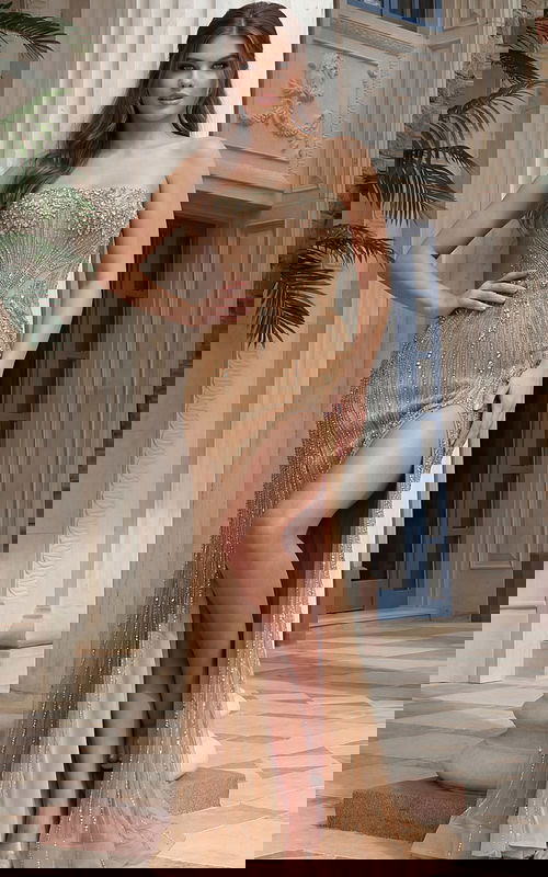 Strapless beaded gown with contoured silhouette and flowing hem