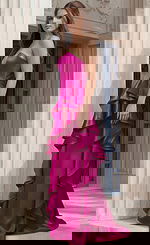 Side view of Jovani 47386 fuchsia satin strapless evening gown with structured bodice and cascading layered ruffle detail from the hip dow