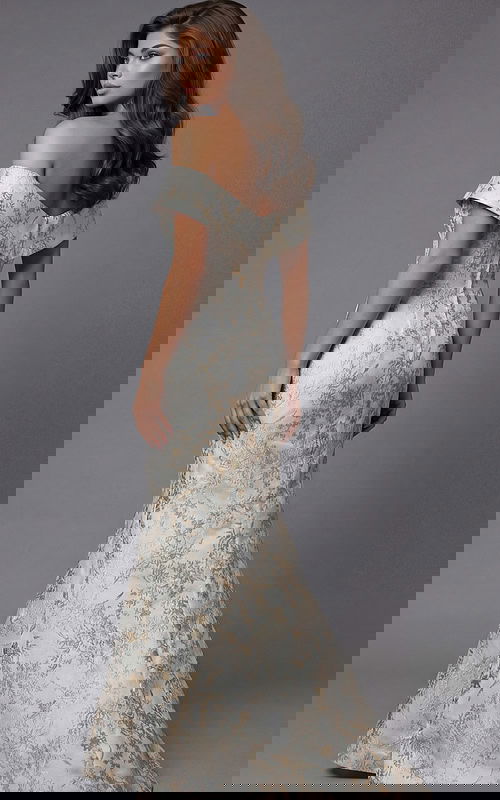 Back view of an off the shoulder evening gown with a fitted silhouette and floor length skirt