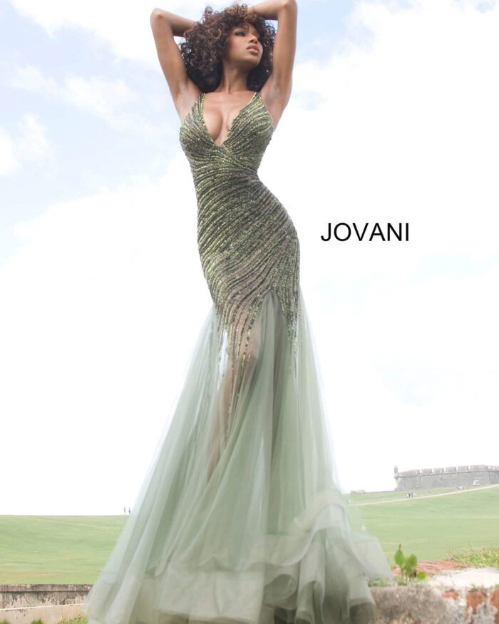 Model in Jovani 4741 green dress with a deep V-neckline and sequin design.