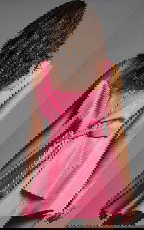 Structured sleeveless dress with square back neckline and oversized bow detail at the waist