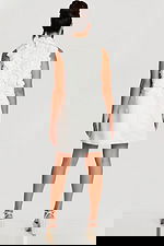 Back view of sleeveless mini dress with floral embellishments