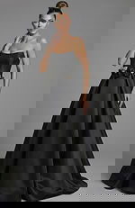 Front view of strapless ball gown with crystal bow waist details