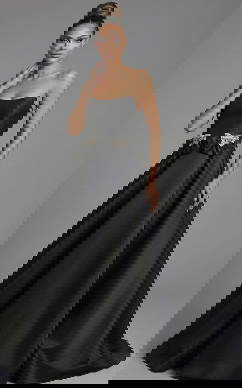 Front view of strapless ball gown with crystal bow waist details