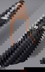 Front view of elegant strapless evening dress featuring an A line silhouette and flared skirtFront view of elegant strapless evening dress featuring an A line silhouette and flared skirt