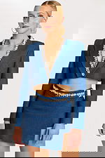 Denim crop blazer with embellished lapel and matching mini skirt featuring rhinestone belt buckle detailing.