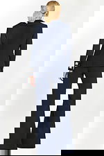 back view of Navy pantsuit with deep V-neck blazer, crystal square buttons, and embellished side bows.