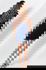 Back view of fitted dress with clean lines and structured shape