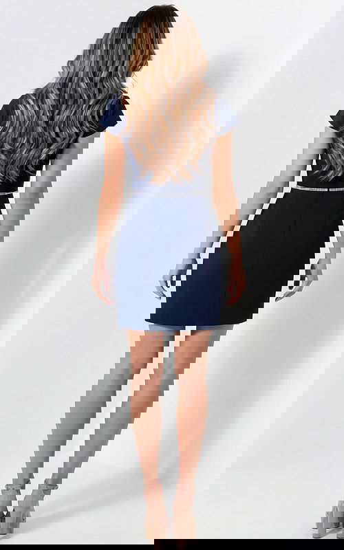 Back view of fitted dress with clean lines and structured shape