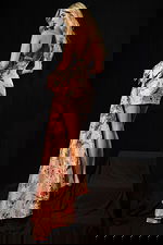 Elegant short floral dress with textured fabric and dramatic bow accent