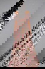 Back view of off shoulder floral gown with button detail and pleated skirt