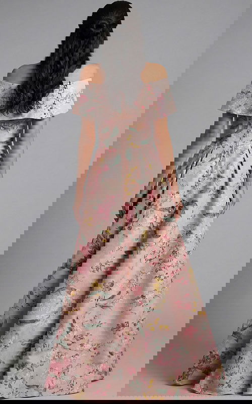 Back view of off shoulder floral gown with button detail and pleated skirt