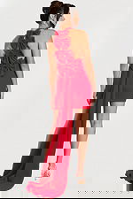 Side-back angle of red halter dress showcasing tiered bows and dramatic train