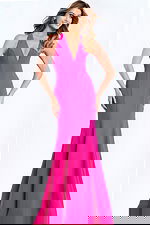 Hot pink halter prom dress with plunging neckline and bow back detail