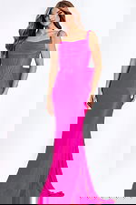 Pink fitted prom dress with draped bodice and large bow back detail