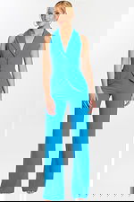 Front view of sleeveless blue tailored jumpsuit with wide-leg pants