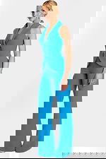Side angle of blue fitted sleeveless jumpsuit with notched lapel