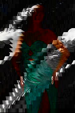 Green metallic prom dress with ruched bust and thigh slit