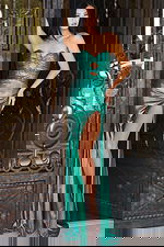 Strapless green gown with sleek silhouette and shimmering finish