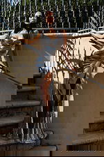 Silver strappy gown with cutout front and shimmering finish