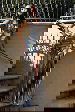 Metallic silver gown with sleek fit and side slit