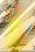 Strapless formal dress featuring cascading ruffle layers