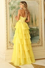 Flowing tiered gown with structured bodice design