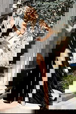 Elegant halter evening gown with beaded trim and flowing train