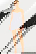 Strapless black mini dress with 3D rose details along the hem