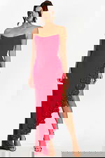 Front view of strapless red gown with floral applique trim along high slit