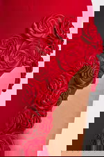 Close-up of satin rosette detailing on red high-slit gown