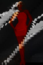 Full-length view of halter embellished dress with sleek silhouette