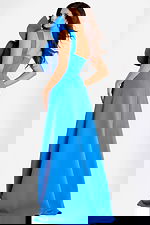 One shoulder blue gown featuring a dramatic oversized bow and flowing A-line skirt, designed for a modern and graceful appearance.