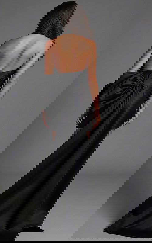 Halter neck mini dress with open back and oversized bow detail