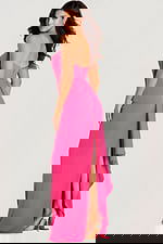 Strapless fitted gown with a cascading back drape and high side slit, designed in smooth fabric for a modern, elegant finish.