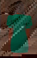 Back view of short fitted dress with puff sleeves and clean center seam