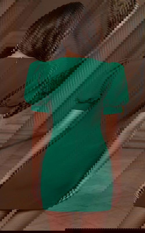 Back view of fitted dress with short puff sleeves and clean finish