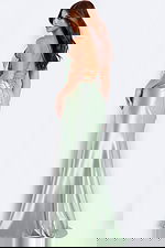 Light green fitted gown with lace-up back and ruched waist