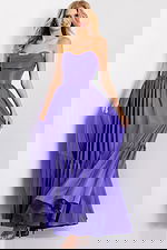 Floor length purple gown with dramatic tiered design