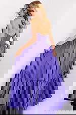 Elegant taffeta ball gown featuring pleated tiered skirt