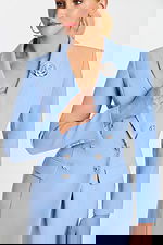 Light blue blazer-style midi dress with long sleeves, silver buttons, and floral brooch detail.