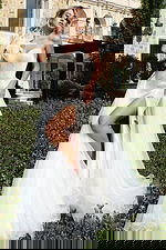 One shoulder gown with oversized floral detail and fitted bodice