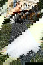 Elegant long gown with slit and sheer layered train