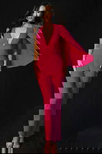 Fitted jumpsuit with plunging neckline and cape sleeve detail