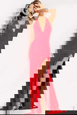 Form-fitting red halter evening dress with side slit