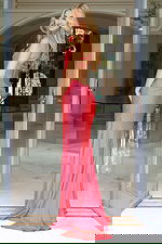 Back view of open back fitted gown with ruched detail