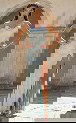 Fitted embellished gown with thin straps, sweetheart neckline, and thigh high slit in a sleek silhouette